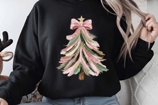 Person wearing a black sweatshirt with a Christmas tree design