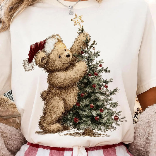 Cream sweatshirt with a teddy bear decorating a Christmas tree design.