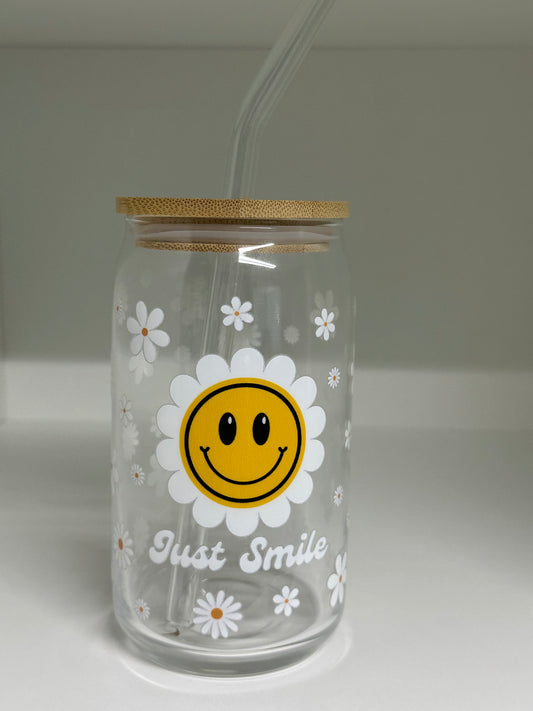 Clear bottle with smiley face design and 'Just Smile' text on a plain background