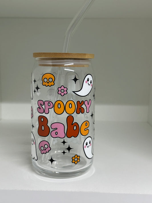 16oz glass cup with ghosts and floral pattern on a clear background