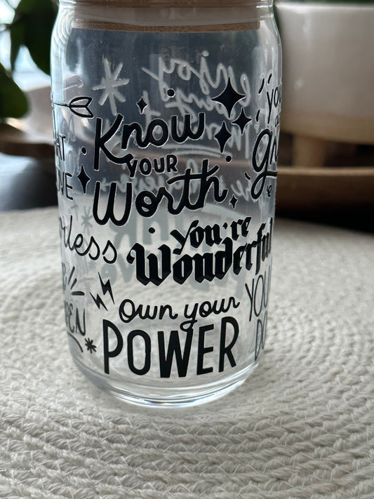 Clear tumbler with motivational text on a white background