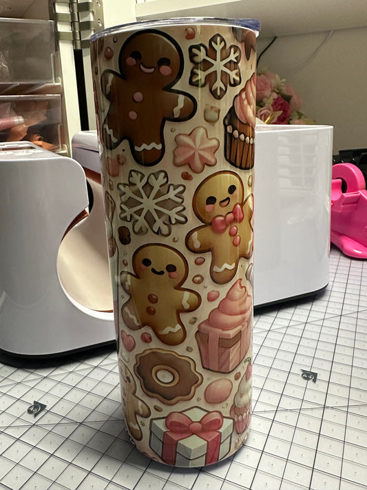  cylindrical object with gingerbread man and snowflake pattern on a grid background