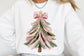 White sweatshirt with a Christmas tree design featuring a bow on a plain background