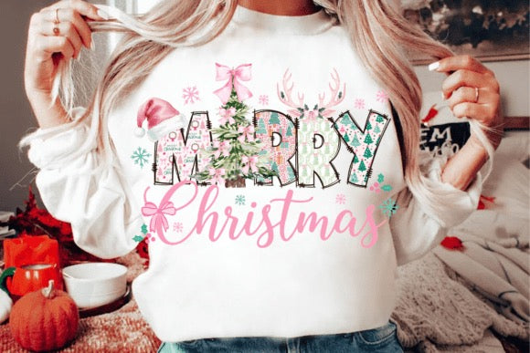 Person wearing a white sweatshirt with 'Merry Christmas' text and festive graphics.