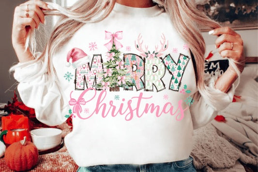 Person wearing a white sweatshirt with 'Merry Christmas' text and festive graphics.